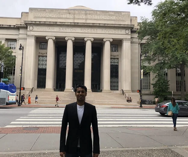 Chander Dhall judging students at MIT